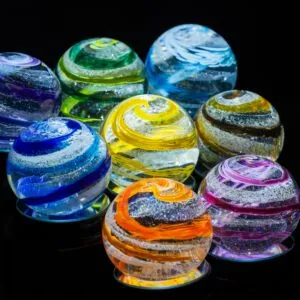 a group of colorful glass balls sitting on top of a table